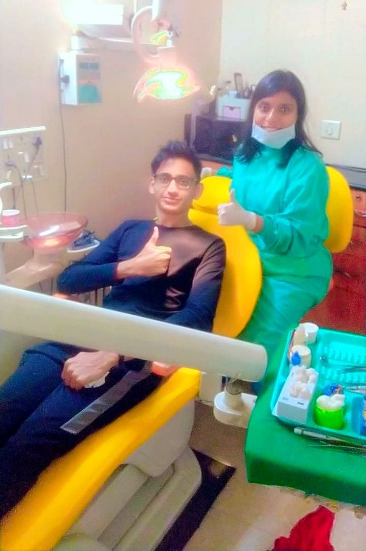 Dr. Neha Agarwal with a happy patient inside Muskan Dental Clinic